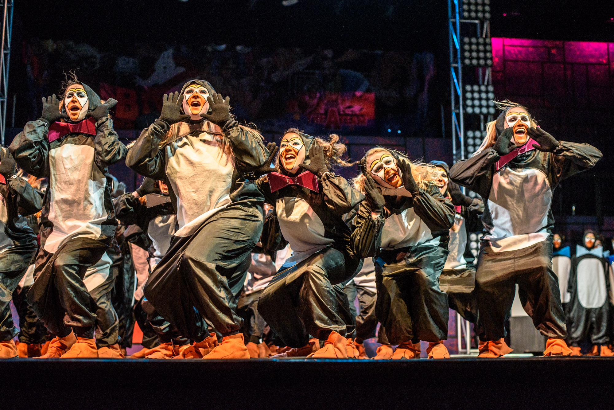 Students in costume on stage acting