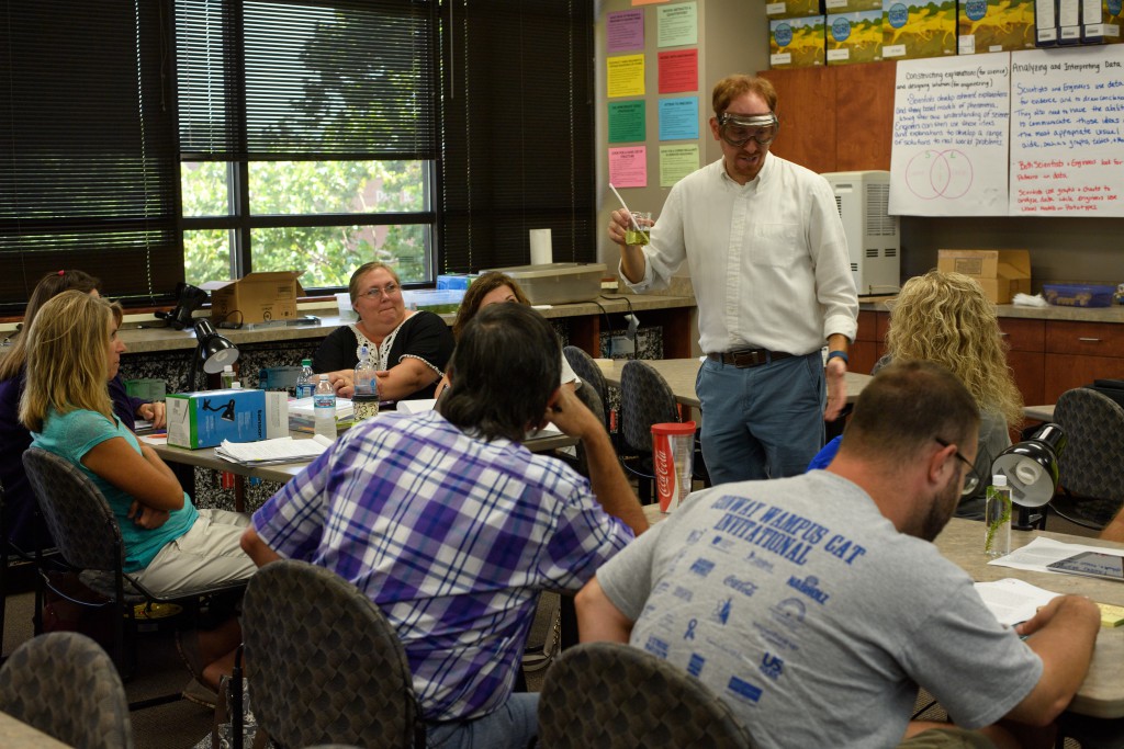 Photo of Dr. Jon White instructing teachers in the STEM Center's workshop.