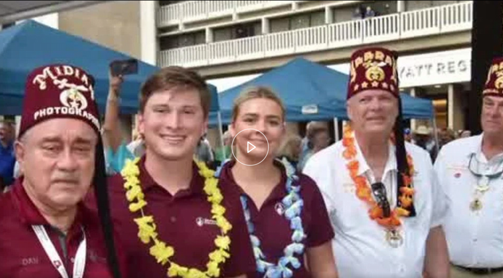 Grayson Hume smiles alongside others from Shriners