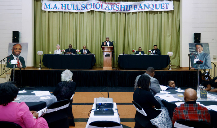 Speaker giving speech at scholarship meeting