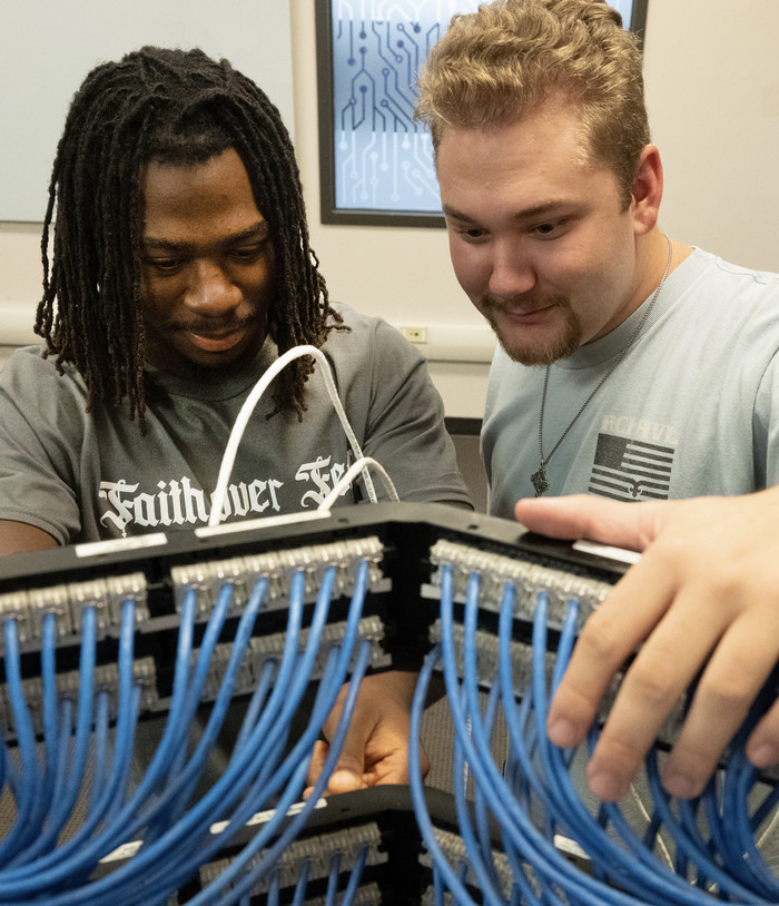 Image of students working on cables