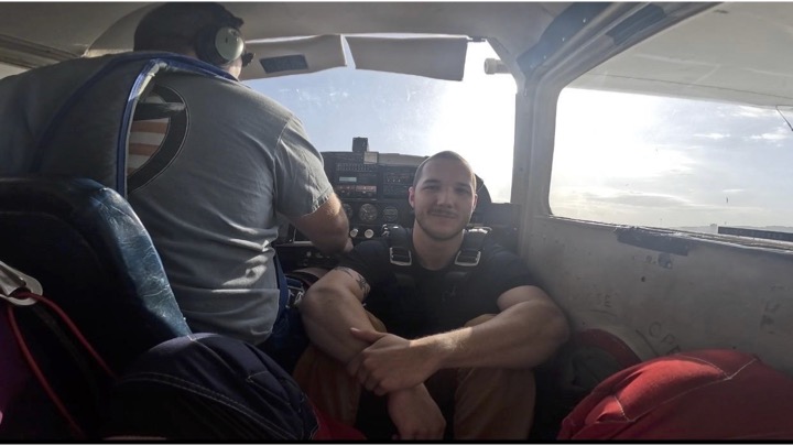 Baker sitting in plane ebefore